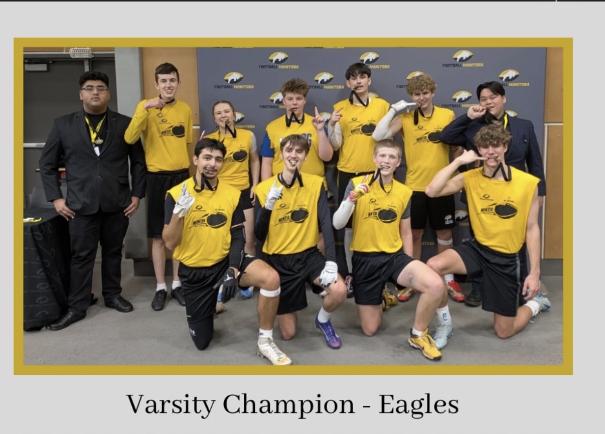 Royals varsity team posing with Football Manitoba medals